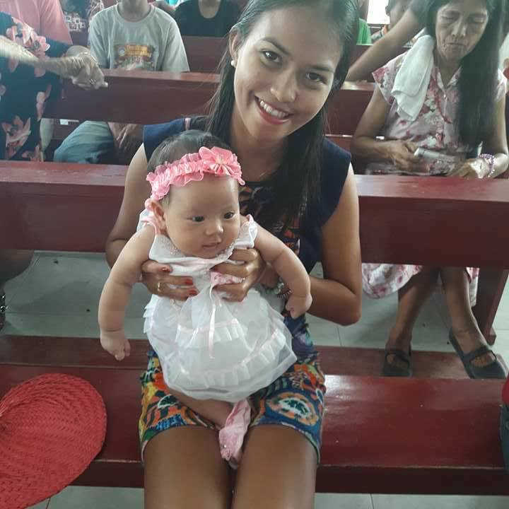 Krista and her godchild Iyesa Lyn during baptism